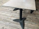 a table that is sitting on a wooden deck