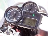 a close up of a motorcycle with a speedometer on it ' s dashboard