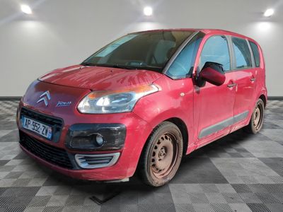 a picture of a red car parked in a garage