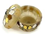 a small bowl with a lid that has flowers on it