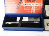 a box with a pen and a lighter in it