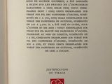 an open book with a picture of a flower on it