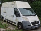a white van that is parked on the side of the road