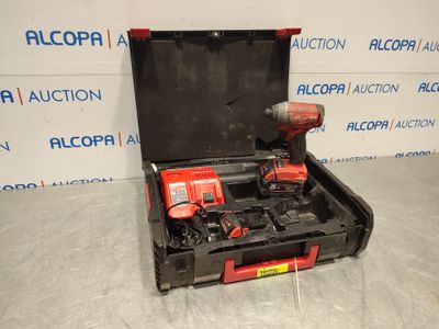 a tool box with two tools in it sitting on a floor