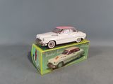 a toy car sitting on top of a box on a table