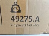 a cardboard box with a bell on top of it