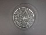 a glass plate with a design on it on a table