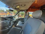 a view of the inside of a truck from the driver ' s seat