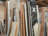 several pieces of wood are stacked on pallets in a warehouse