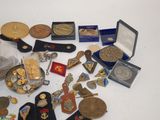 a lot of medals and other items on the table