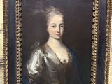 a painting of a woman in a blue dress in a gold frame