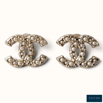 two pairs of chanel earrings with pearls on them