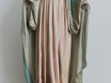 a statue of a woman with a robe on