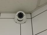 a camera that is on the floor of a bathroom