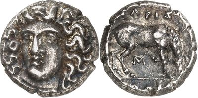 a silver coin with an image of a man on it