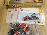 a box of legos sitting on a table next to a box of legos