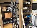 a room with a lot of wires and a computer