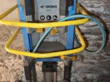 a picture of a machine with a hose attached to it