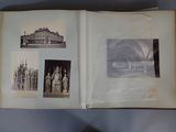 an open book with pictures of buildings and statues on it