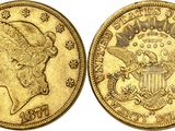 une pièce d'or sur laquelle figurent le portrait d'une femme et un aigle