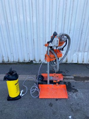 a machine that is sitting on the ground next to a fire hydrant