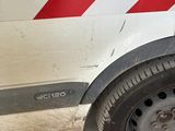 a white van with a red and white stripe on the side