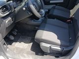 the interior of a car with the driver ' s seat folded down