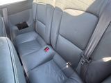 the back seats of a car with a seat belt in the back