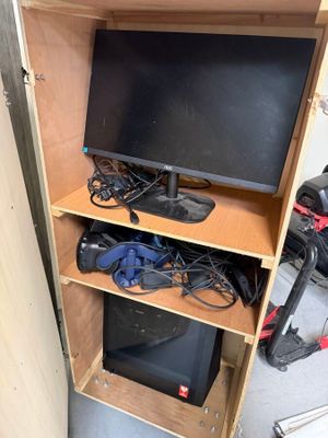 a tv that is sitting on top of a wooden cabinet