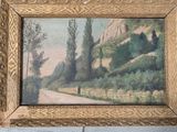 a picture of a painting hanging on a wall next to a dresser
