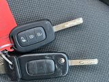 two keys that are sitting on the seat of a car