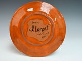 an orange plate that has a label on it