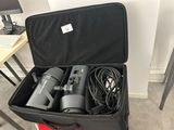 a black suitcase with two hair dryers inside of it