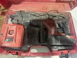 a red tool box with tools in it on a table
