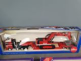 a toy truck with a crane in the box