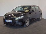 a picture of a black car parked in a showroom