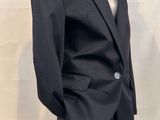 a mannequin wearing a suit and tie on a mannequin mannequin