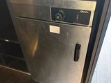 a stainless steel dishwasher in the middle of a kitchen