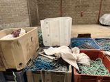 a pile of fishing nets and other items on the floor