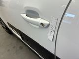 a close up of a car door handle with a sticker on it