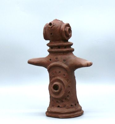 une image représentant une figurine en argile représentant une bouche d'incendie