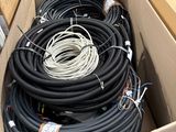 a box full of black and white wires and wires