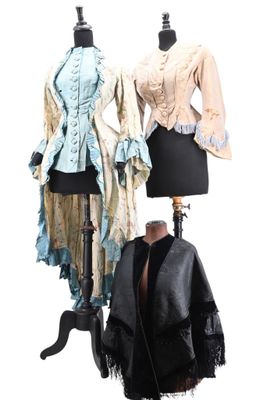 two mannequins that are standing next to each other
