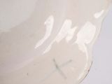 a white plate with a flower design on it