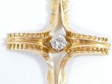 an image of a gold cross with a diamond in the center