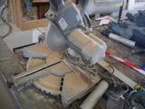 someone is using a circular saw to cut a piece of wood