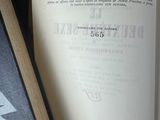 a book with a picture of a giraffe on it next to a book with a picture of a giraffe on it