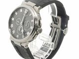 a black watch with roman numerals on the face