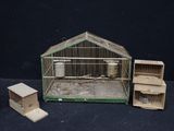 a small bird cage with a bird inside of it