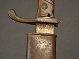 a close up of a knife on a stand